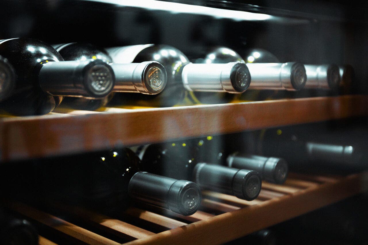 Storing bottles of wine in fridge.